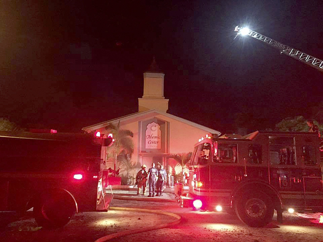 Firefighters work at the scene of a fire at the Islamic Center of Fort Pierce on Monday in Fort Pierce, Florida. (St. Lucie Sheriff’s Office via AP)