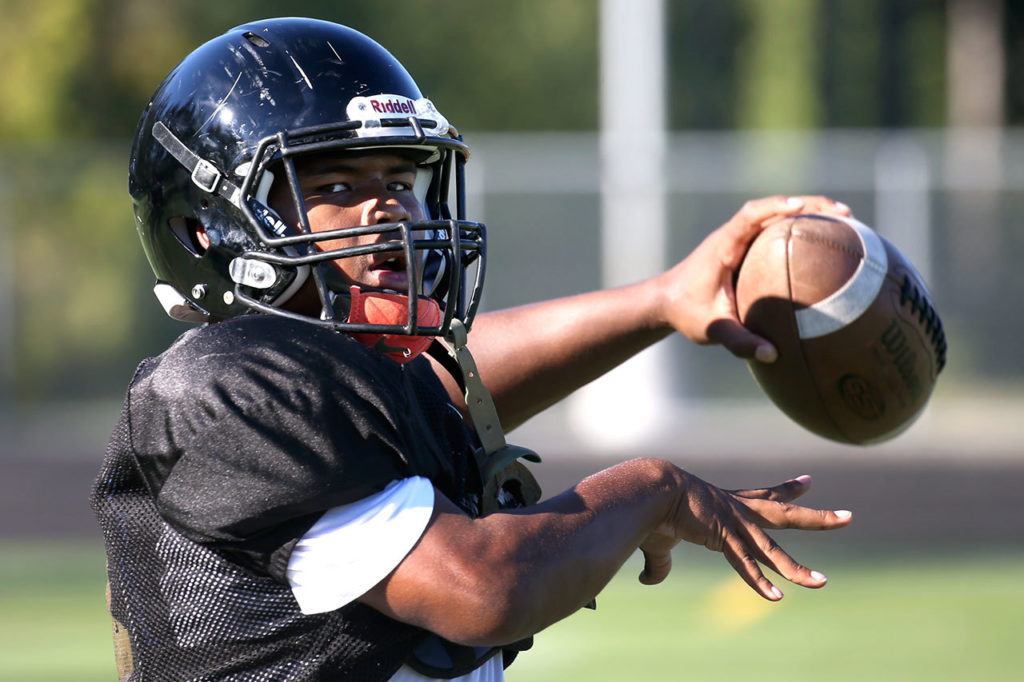 Lynnwood quarterback Alton Hammond warms up during practice Wednesday afternoon at Lynnwood High School in Bothell. (Kevin Clark / The Herald)
