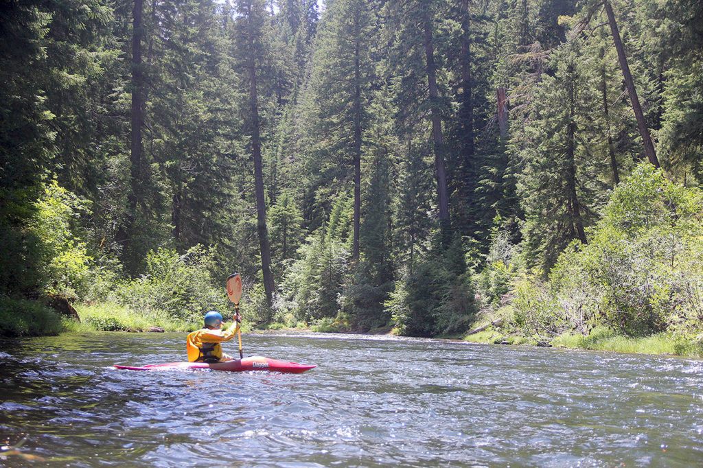 Jim Heck paddles his kayak down the North Fork Rogue River. (Zach Urness / Statesman Journal)
