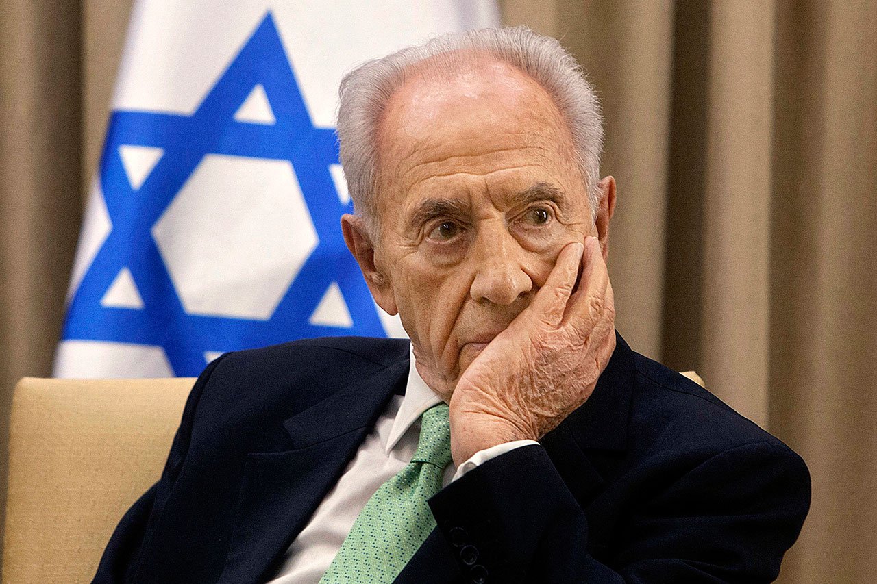 In this Oct. 28, 2013, photo, Israel’s President Shimon Peres, listens during a meeting at the president’s residence in Jerusalem. (AP Photo/Sebastian Scheiner, File)