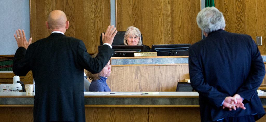 John Whitaker’s defense attorney, Peter Offenbecher (left) argues for a mistrial in front of Superior Court Judge Linda Krese as Seth Fine, assistant chief criminal deputy prosecutor, folds back his arms and listens during proceedings at the Snohomish County Courthouse on Wednesday in Everett. (Andy Bronson / The Herald)
