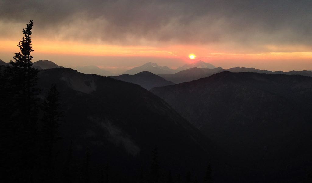 Jessi Loerch / The Herald 
The sun sets behind the mountains, as seen from the Pacific Crest Trail north of Hart’s Pass.
