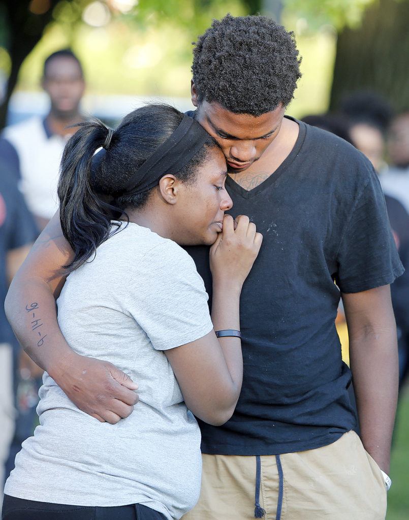 Members of Tyre King’s family console each other during a vigil for 13-year-old Tyre King on Thursday in Columbus, Ohio. King was shot and killed by Columbus police Wednesday evening. (AP Photo/Jay LaPrete)
