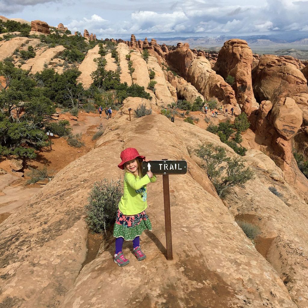 Lily Welcker helps point out the way at Arches National Park. (Maureen Welcker)
