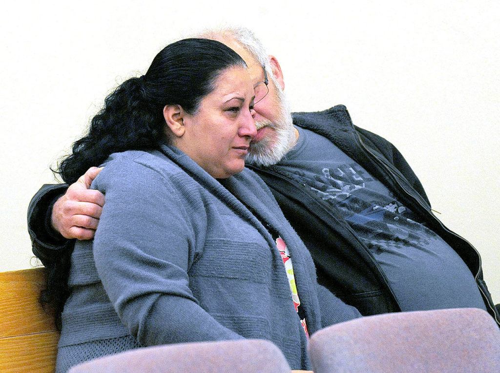 Arcan Cetin’s mother cries openly in Skagit County District Court on Monday before her son appeared before the judge under a magistrate’s warrant which will give Skagit County prosecutors 30 days to file official charges against him in the Cascade Mall shooting where five people were murdered on Friday in Burlington. (Brandy Shreve/Skagit Valley Herald via AP)
