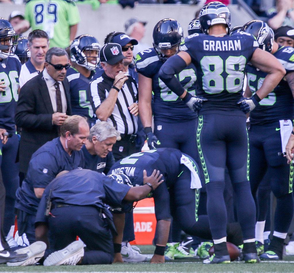 Seahawks quarterback Russell Wilson is seen to after a horse collar tackle Sunday afternoon at Century Link Field in Seattle on September 25, 2016. The Seahawks are 2-1 after defeating the 49ers 37-18. (Kevin Clark / The Herald)
