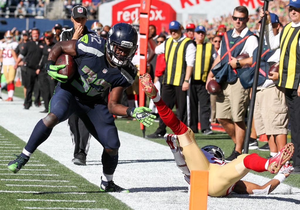 Seahawks running back Christine Michael is dragged out of bounds shy of the end zone by 49ers corner back Keith Reaser Sunday afternoon at Century Link Field in Seattle on September 25, 2016. The Seahawks are 2-1 after defeating the 49ers 37-18. (Kevin Clark / The Herald)
