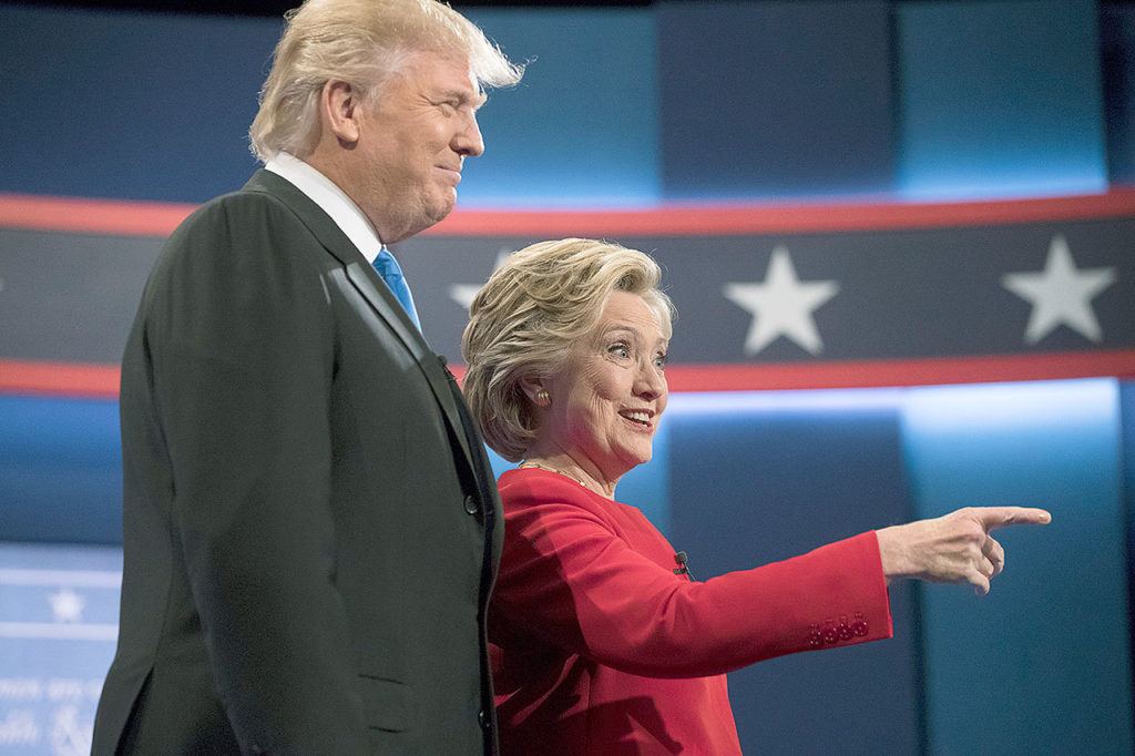 Democratic presidential nominee Hillary Clinton (right) stands with Republican presidential nominee Donald Trump at the start of the presidential debate at Hofstra University in Hempstead, New York, on Monday. (AP Photo/Matt Rourke)
