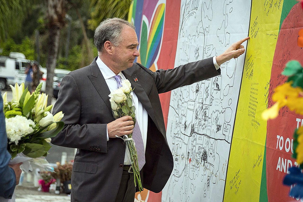 Democratic vice presidential candidate Tim Kaine visits a memorial site at Pulse, the gay club where 49 were killed in a mass shooting in June, in Orlando, Florida, on Monday. (Loren Elliott/The Tampa Bay Times via AP)