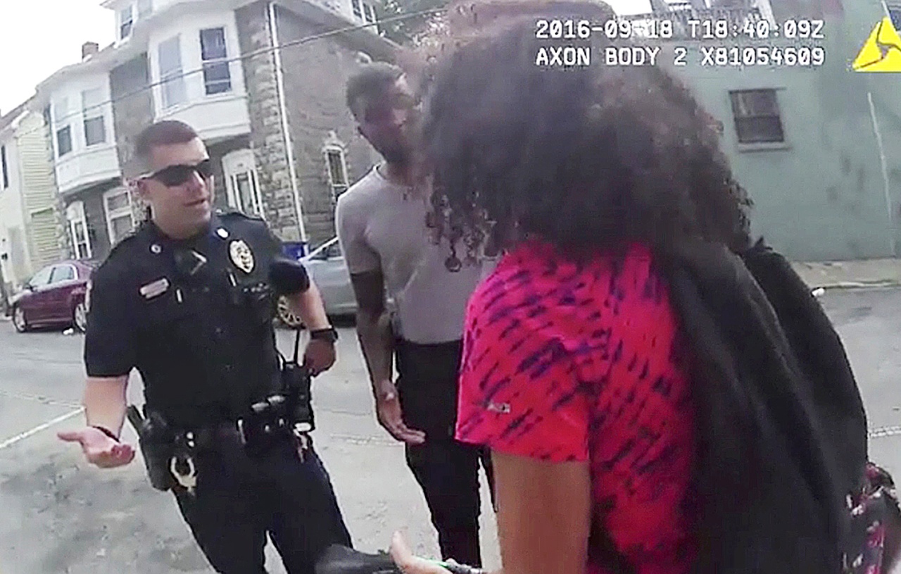 In this Sunday video frame grab from a police body camera, an officer speaks with a 15-year-old girl in Hagerstown, Maryland. An officer pepper-sprayed the 15-year-old girl in a police cruiser when she refused to put her feet inside. (Hagerstown police via AP)