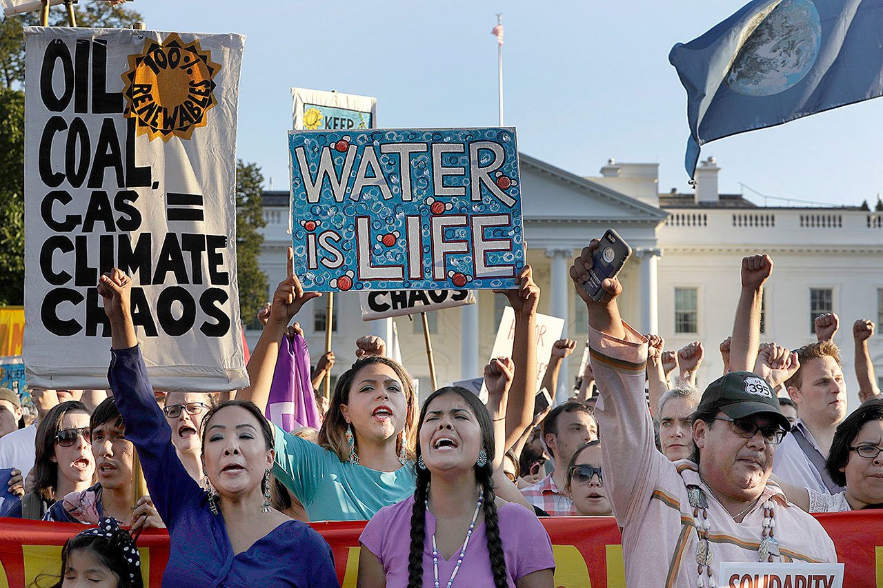 Supporters of the Standing Rock Sioux Tribe rally in opposition of the Dakota Access oil pipeline in front of the White House on Tuesday in Washington D.C. The company developing the $3.8 billion Dakota Access pipeline says it is committed to the project, despite strong opposition and a federal order to halt construction near an American Indian reservation in North Dakota. (AP Photo/Jacquelyn Martin)
