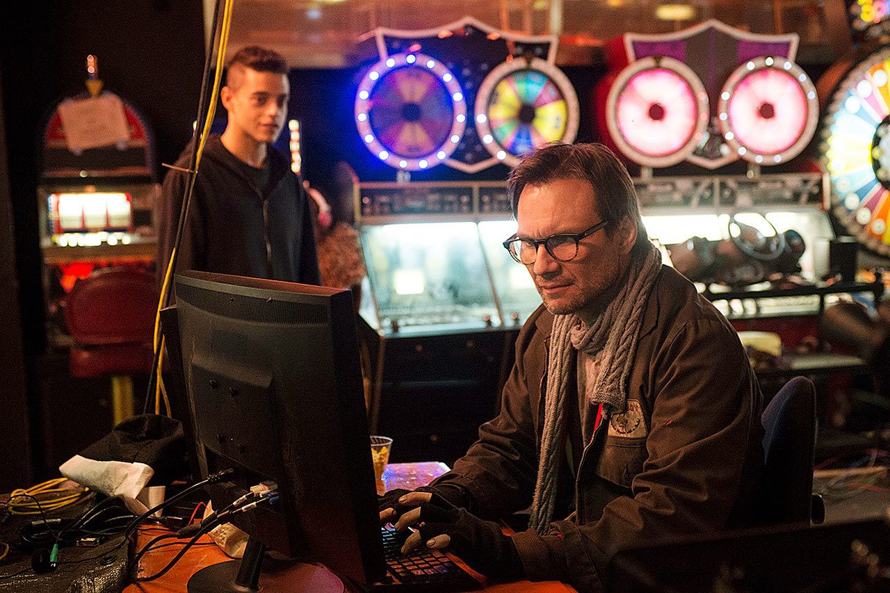 Rami Malek (left) as Elliot and Christian Slater as Mr. Robot in a scene from the pilot episode of the television series “Mr. Robot.” The creative team behind the award-winning “Mr. Robot” knows that if it doesn’t get details right, they’re going to hear about it. Unlike other shows about hackers, “Mr. Robot,” which wraps up its second season Wednesday on the USA Network, has been praised by the hacker community for realistically portraying what they do. (David Giesbrecht / USA Network)