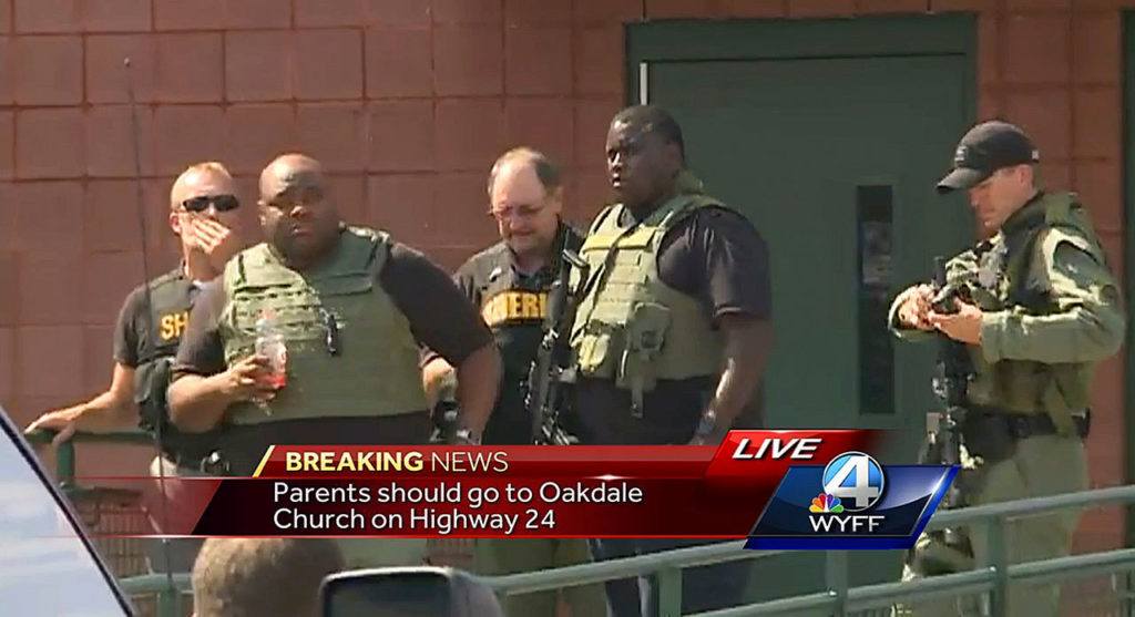 In this frame from video, law enforcement officers respond to reports of a shooting at Townville Elementary School in Townville, South Carolina, on Wednesday. (WYFF via AP)
