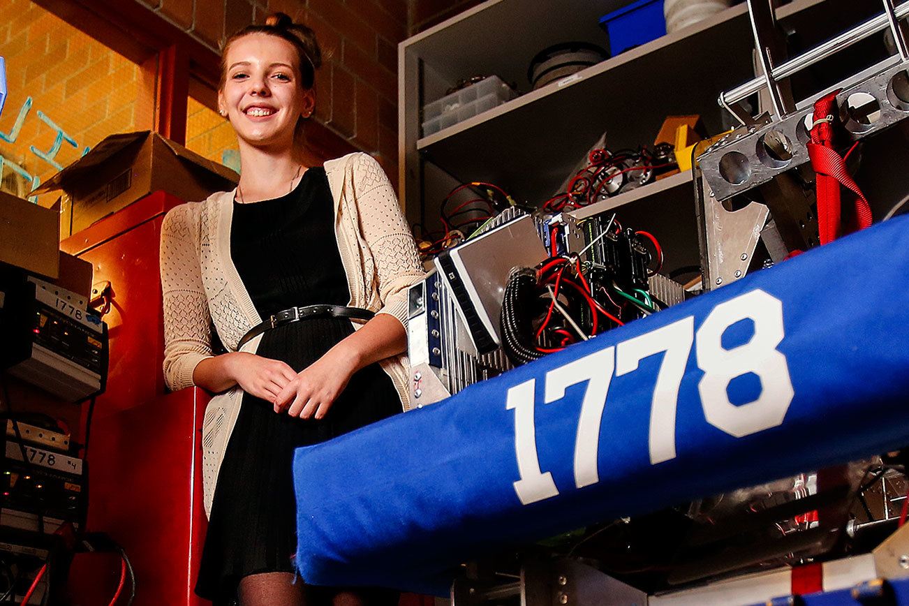Mountlake Terrace senior, Elizabeth Jurgensen, 17, is part of her school’s STEM program, and is into robotics. She is the Herald Super Kid this week. “Chill,” at right, is a seriously cool robot. (Dan Bates / The Herald)