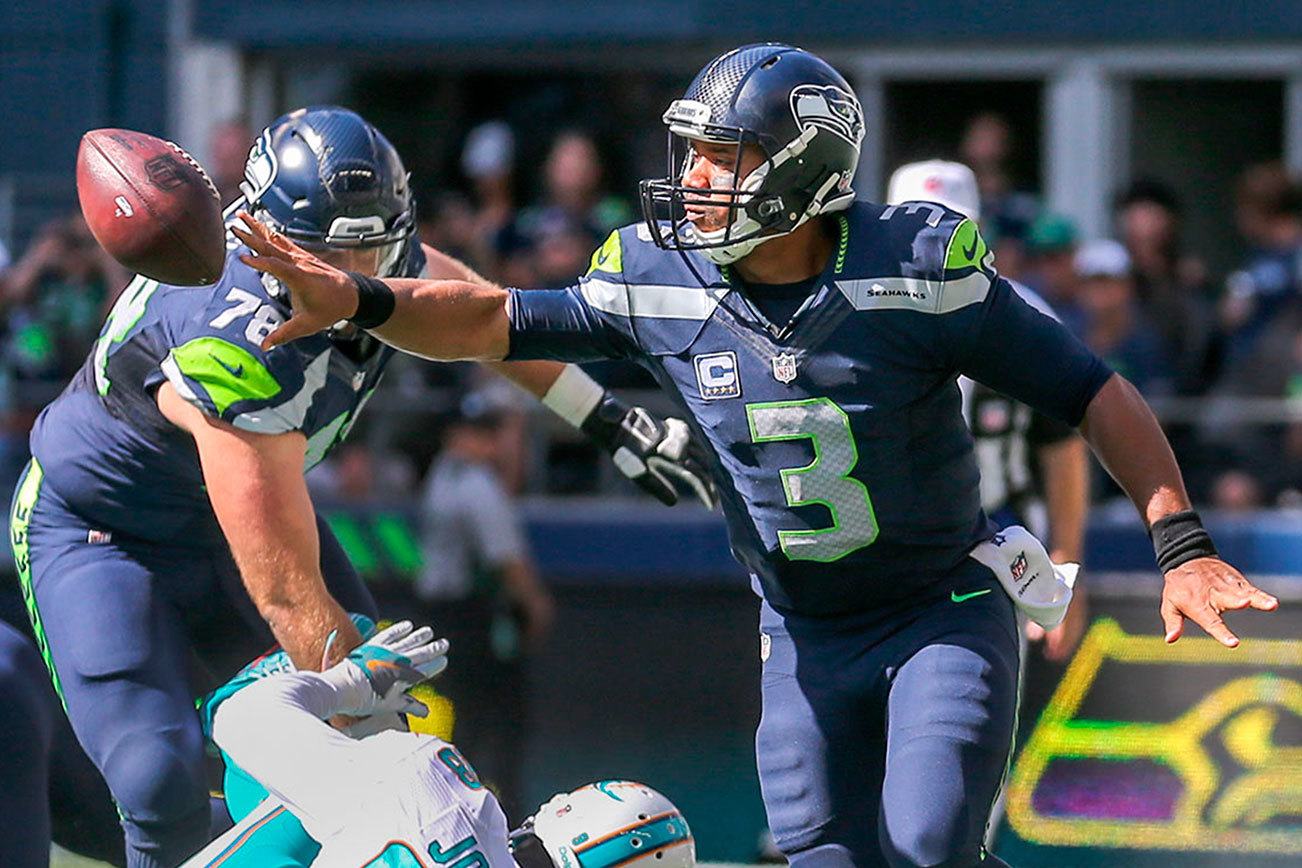 Wilson directs Seahawks’ game-winning drive on a bad ankle