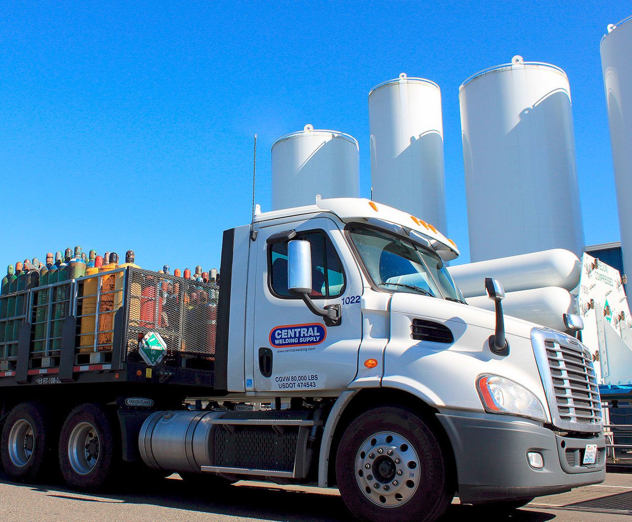 Central Welding Supply’s fleet of trucks distributes gases, welding equipment and industrial supplies throughout Western Washington. The company stores gas in bulk in these white towers in Smokey Point. (Contributed photo)