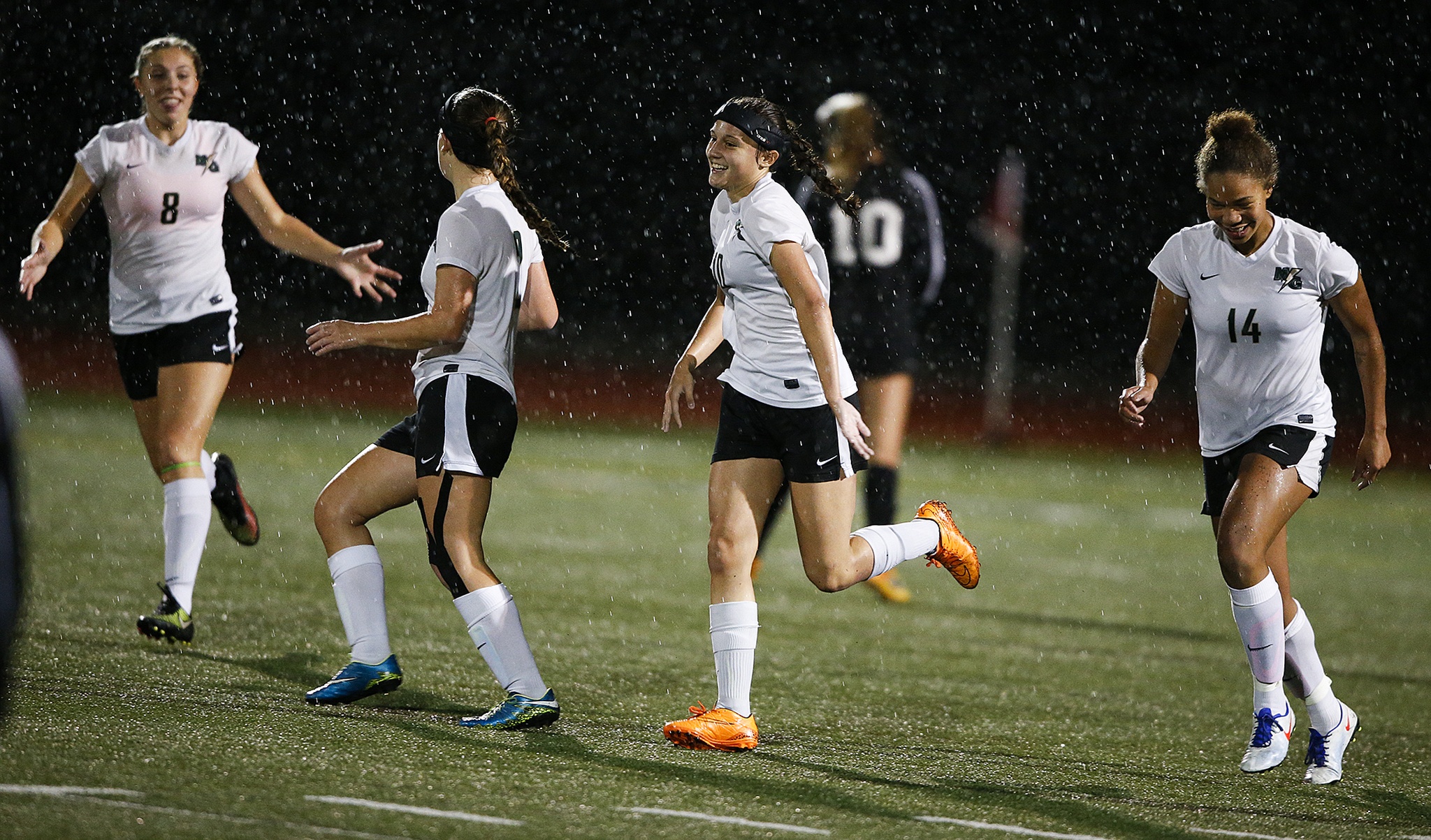 Marysville-Getchell’s Hayli Huhta (center) smiles after scoring to go up 2-0 on Snohomish in the first half of a game at Marysville-Getchell High School on Tuesday, Oct. 4. (Ian Terry / The Herald)