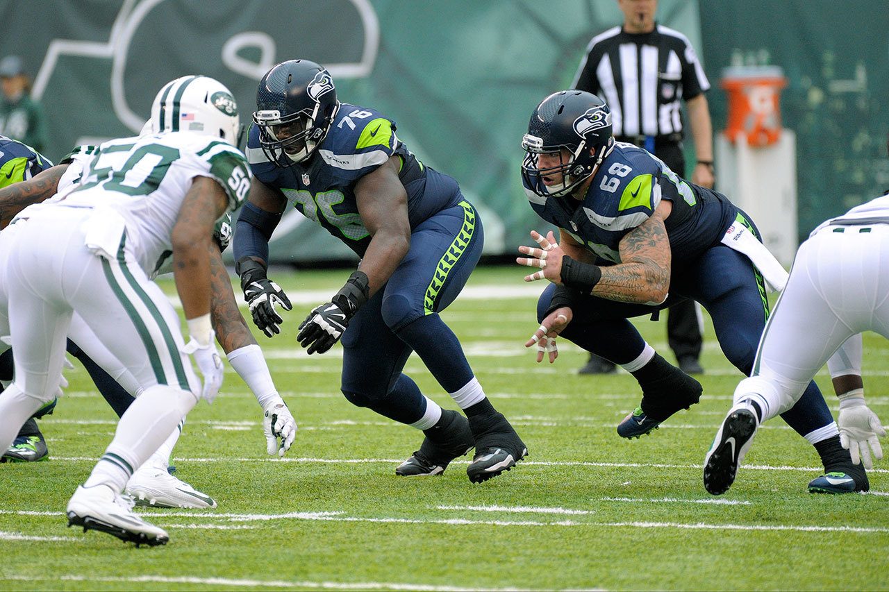 Bill Kostroun / Associated Press                                Seattle Seahawks offensive guard Germain Ifedi (76) and center Justin Britt (68) fire off the line during a game against the New York Jets on Oct. 2, 2016, in East Rutherford, N.J.