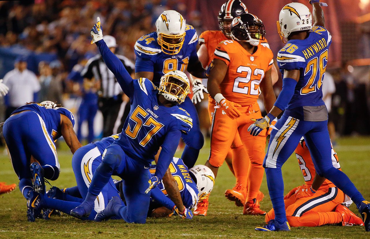 Chargers inside linebacker Jatavis Brown (57) reacts after a fumble recovery during the second half of a game against the Broncos on Thursday in San Diego. (AP Photo/Lenny Ignelzi)