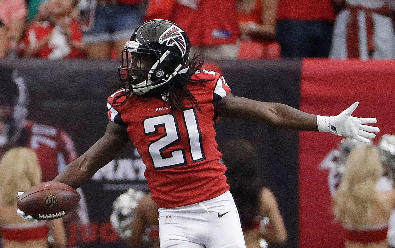 Falcons cornerback Desmond Trufant (21), a former star at the University of Washington, celebrates picking off Buccaneers quarterback Jameis Winston (3) during the first half of a game Sept. 11 in Atlanta. (AP Photo/David Goldman)