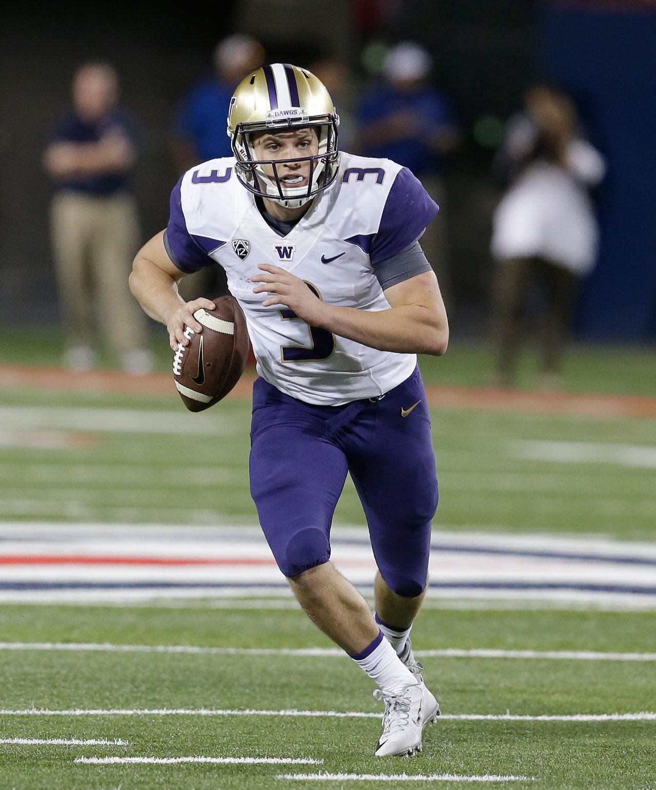 Washington quarterback Jake Browning (3) looks to pass during the first half of a game against Arizona on Sept. 24 in Tucson, Ariz. (AP Photo/Rick Scuteri)