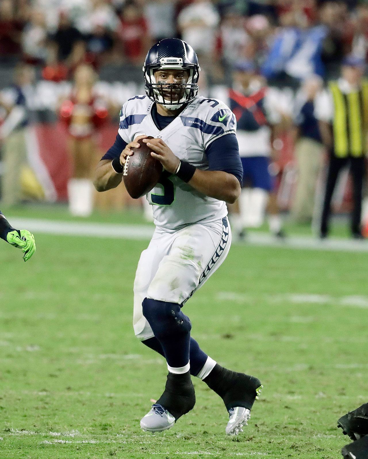 Seattle quarterback Russell Wilson (3) drops back to pass in the first half of the Seahawks’ 6-6 tie with Arizona on Sunday in Glendale, Ariz. It may be time for the Seahawks to give their starter a week off to rest his myriad injuries. (AP Photo/Rick Scuteri)