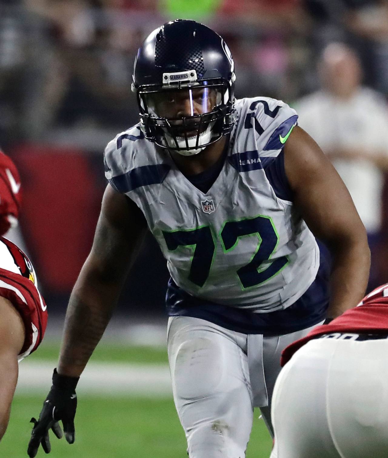 Seahawks defensive end Michael Bennett (72) awaits the snap during a game against the Cardinals on Oct. 23 in Glendale, Ariz. (AP Photo/Rick Scuteri)