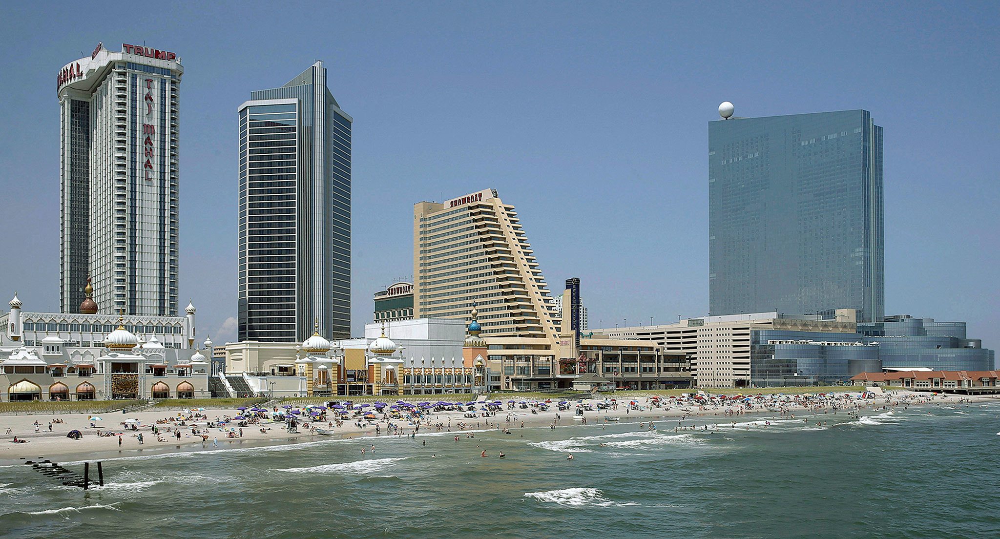 From left, the Trump Taj Mahal Casino, the Showboat Casino Hotel and the Revel Casino Hotel in Atlantic City, New Jersey. The Trump Taj Mahal opened 26 years ago, but it closed on Monday. (AP Photo/Mel Evans)