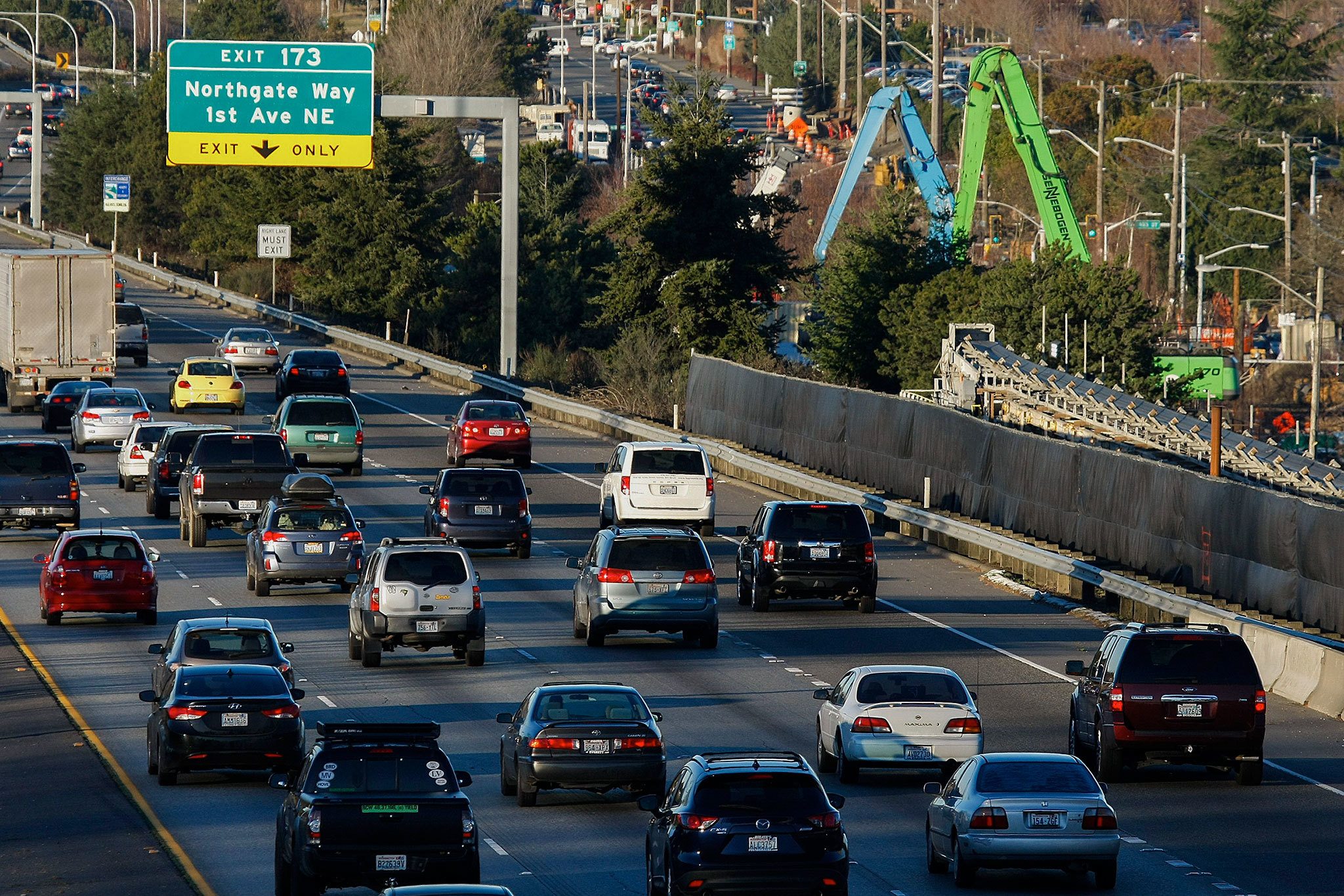 Construction on the Northgate Link light rail extension is seen at right as cars pass on northbound I-5. (Ian Terry / The Herald)