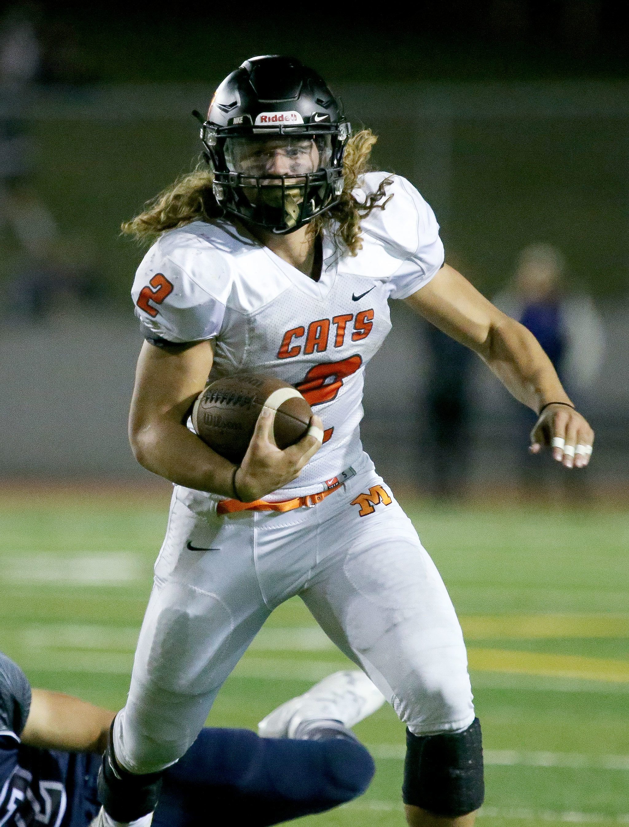 Monroe running back JJ Jerome eludes a tackler during a game against Glacier Peak on Sept. 30 in Monroe. (Kevin Clark / The Herald)