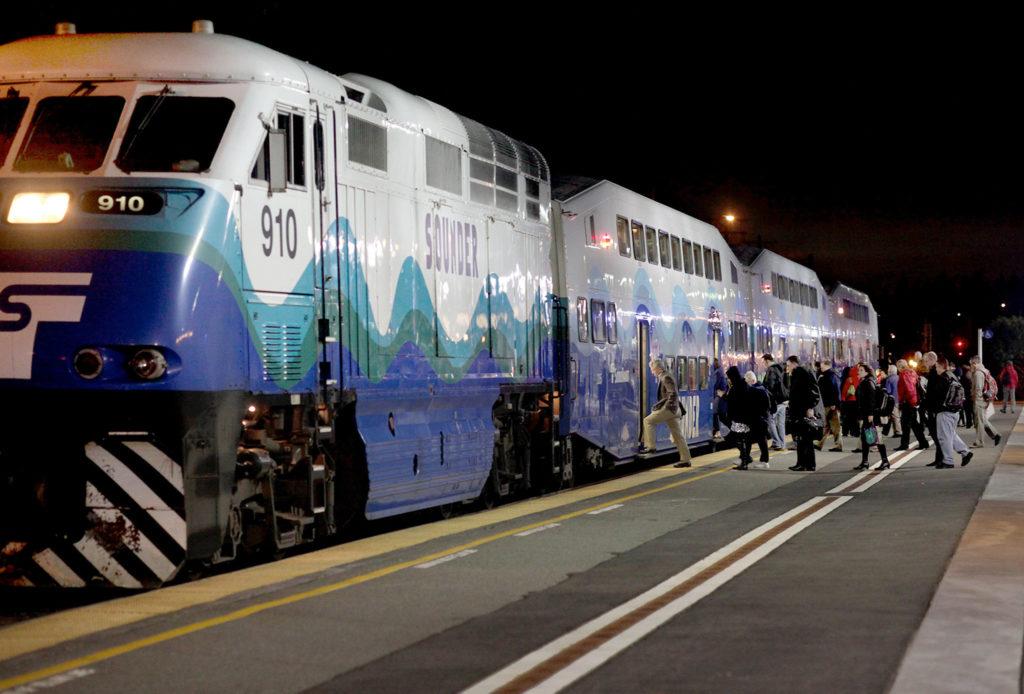 Passengers board the Sounder train for Seattle from Edmonds. The heavy-rail line along waterfront rail tracks was supposed to provide relief in Snohomish County as commuters awaited light rail. But the northern portion of the has under-performed. (Michael O’Leary / The Herald)
