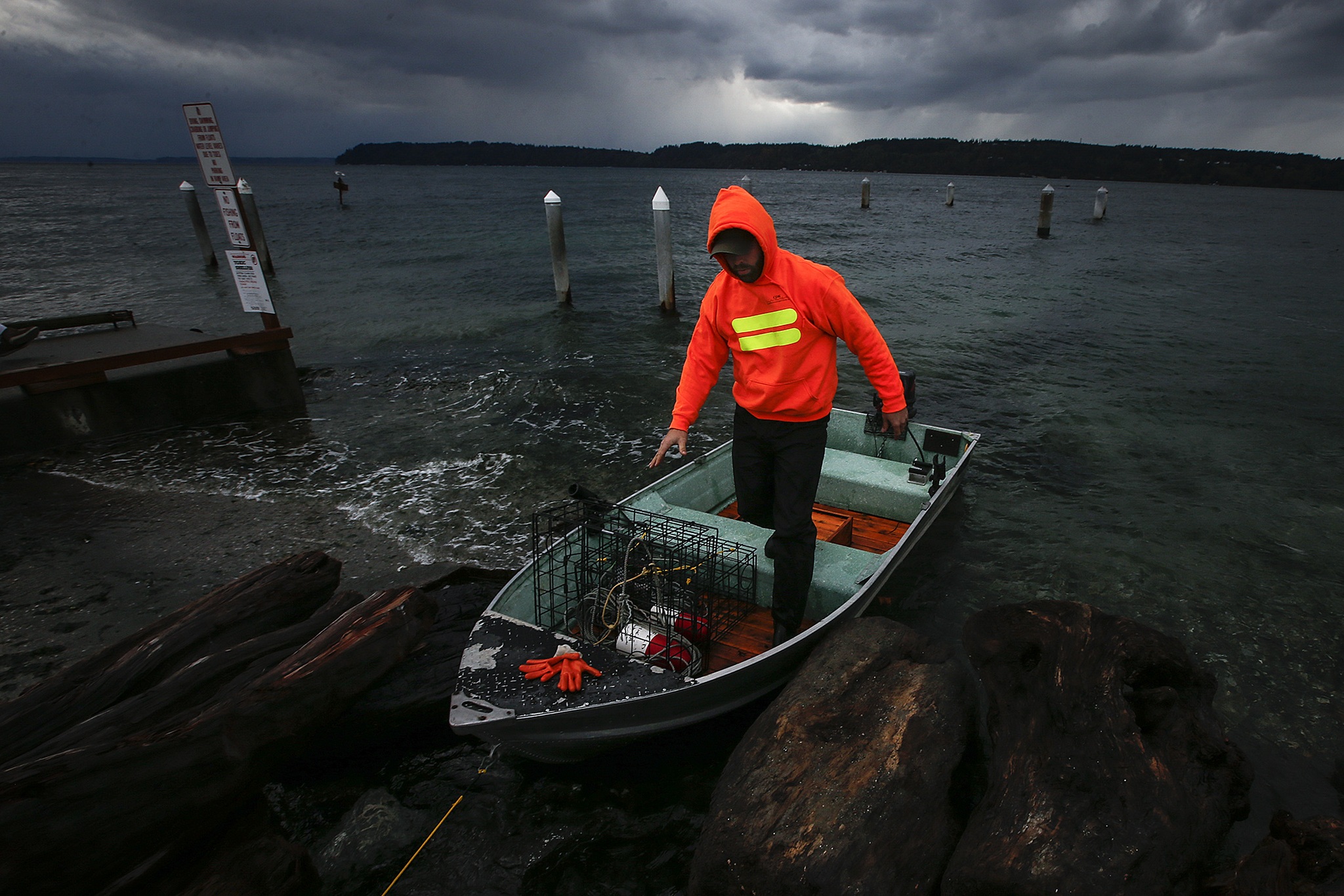 Chris Parsons, of Marysville, prepares to head out into the waters off the coast of Mukilteo to snatch up a crab pot he’d set earlier in the morning on Saturday before more blustery conditions came in later in the evening. Parsons was able to pull in his limit of five crabs in just under two hours. (Ian Terry / The Herald)