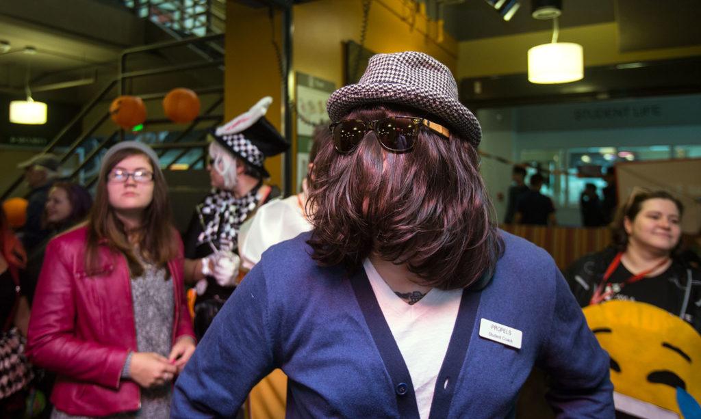 Dressed as Cousin It and using his own hair, Mike Marshall lines up to compete in the Hallo-Scream Contest at Everett Community College on Monday. (Andy Bronson / The Herald)
