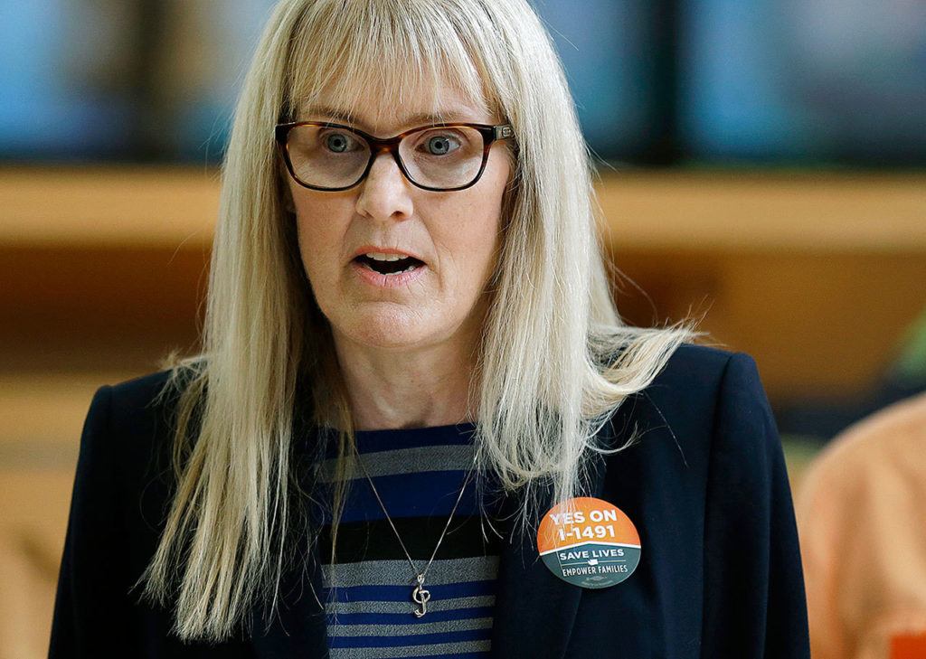 Marilyn Balcerak, of Bonney Lake, speaks at a Sept. 21 news conference in Bellevue, promoting Initiative 1491. In 2015, Balcerak’s son James killed himself and his step-sister, Brianna Smith. Marilyn Balcerak said the initiative could have possibly kept them both from harm. (AP Photo/Ted S. Warren)
