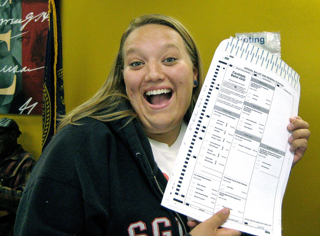 In this Oct. 20, 2008, photo, Nikola Halycyone Jordan poses with her election ballot in Omaha, Nebraska. (Mari Zaporowski/Courtesy of Nikola Halycyone Jordan via AP)