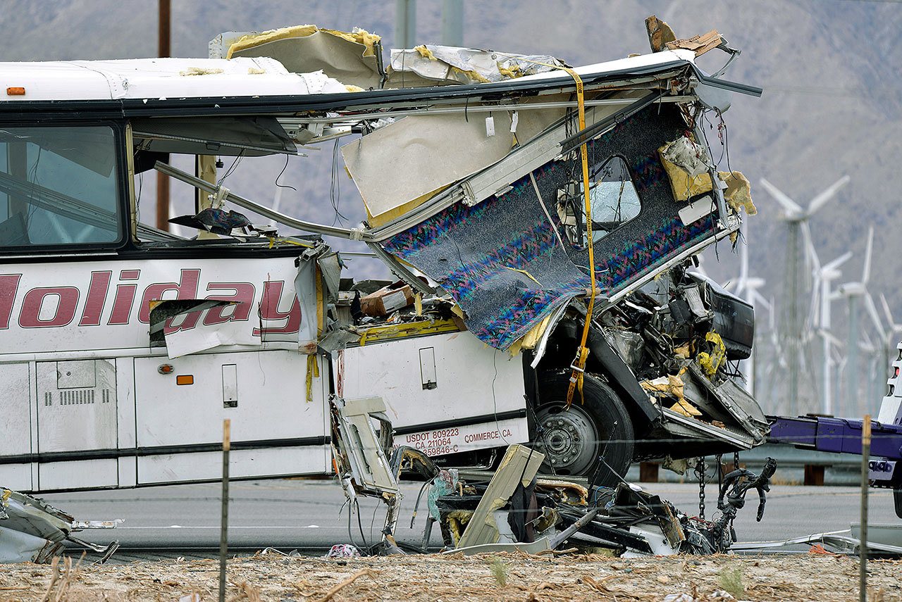 The damaged front of a tour bus which crashed into the back of a semi-truck on I-10 in Desert Hot Springs, California, on Sunday. (AP Photo/Rodrigo Pena)