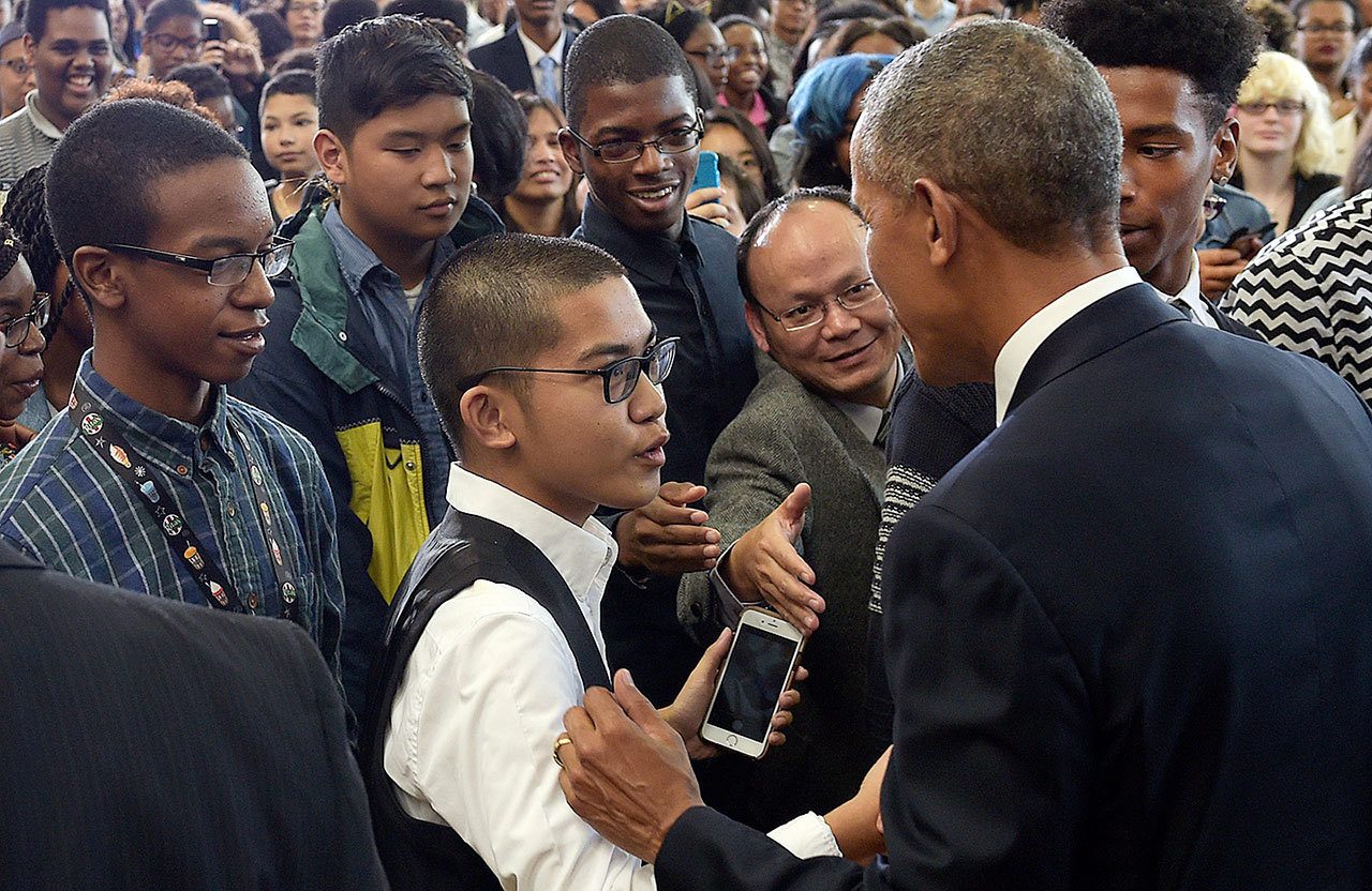 President Barack Obama greets students after speaking at Benjamin Banneker Academic High School in Washington on Monday, where he highlighted the steady increase in graduation rates. (AP Photo/Susan Walsh)