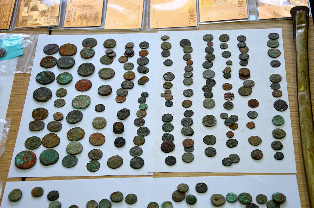 Dozens of illegally-excavated ancient coins were seized. (Greek Police)
