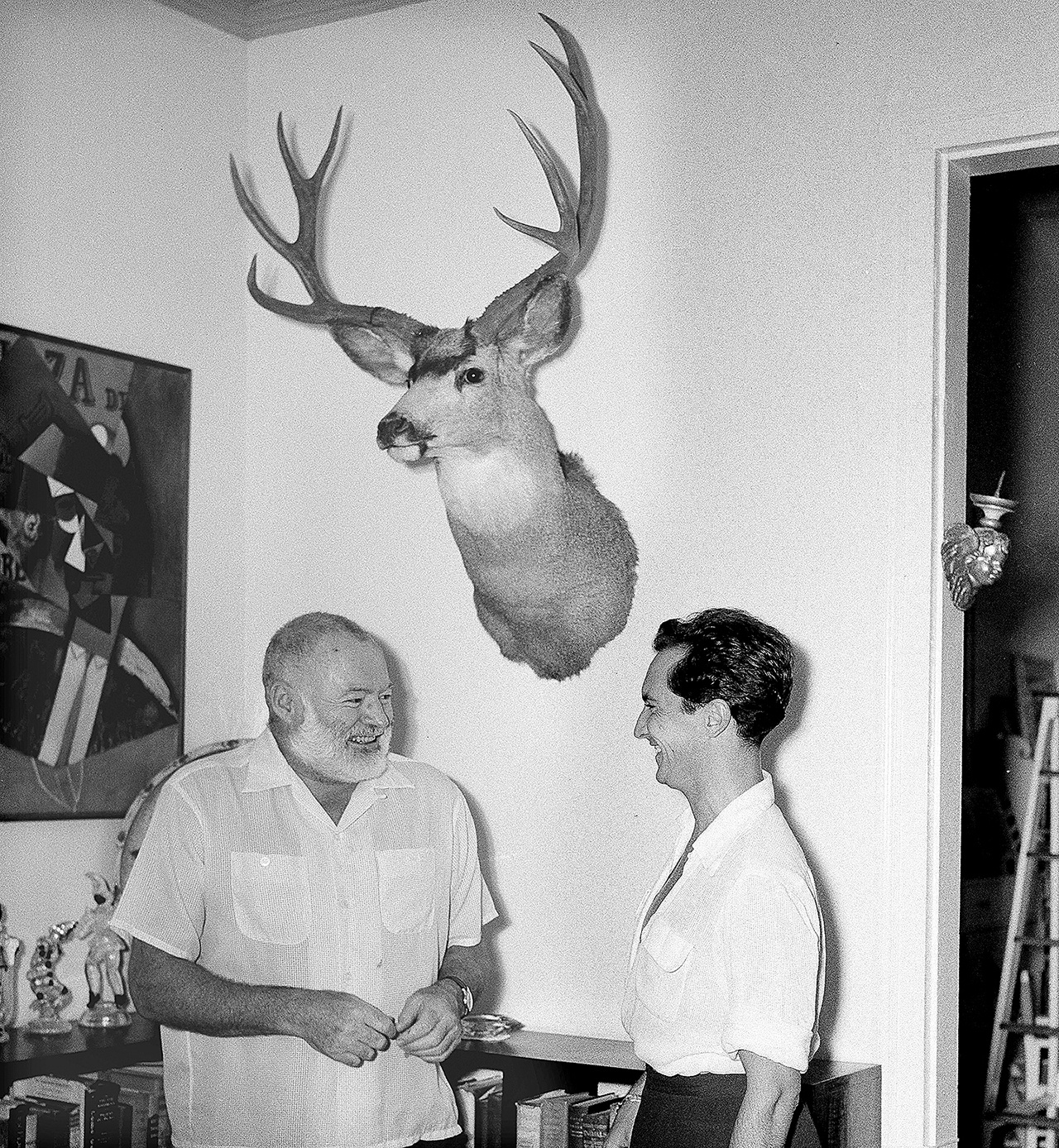 In this Sept. 2, 1954, photo, Luis Miguel Dominguin, right, retired Spanish bullfighter, visits with U.S. author Ernest Hemingway at Hemingway’s home in San Francisco de Paula, Cuba. (AP Photo/File)