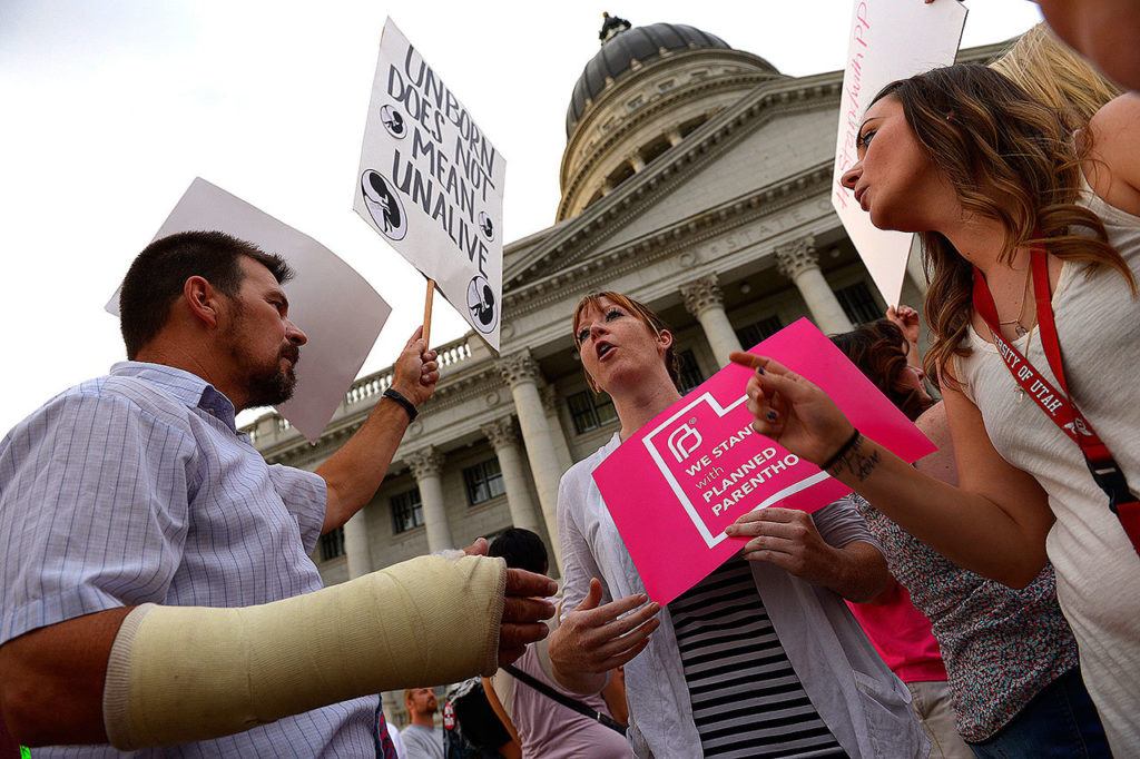Brandi Jensen (center), shares her opinions with an anti-abortion protester as the Planned Parenthood Action Council holds a rally at the state Capitol in Salt Lake City in 2015. (Leah Hogsten/The Salt Lake Tribune)
