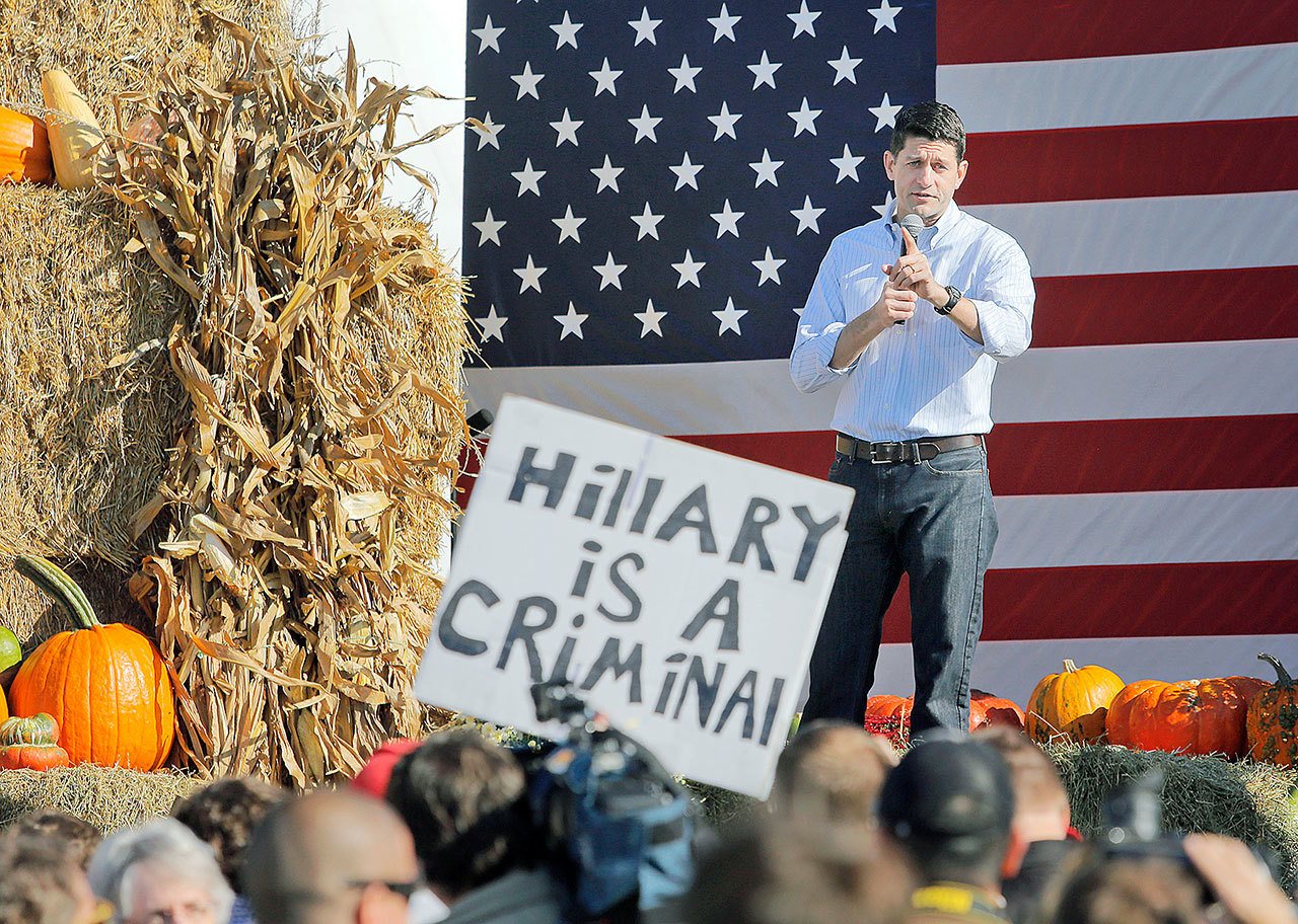 A Donald Trump supporter moves closer with a sign while heckling House Speaker Paul Ryan during his speech at the 1st Congressional District Republican Party of Wisconsin’s annual Fall Fest in Elkhorn on Saturday. (Anthony Wahl/The Janesville Gazette via AP)