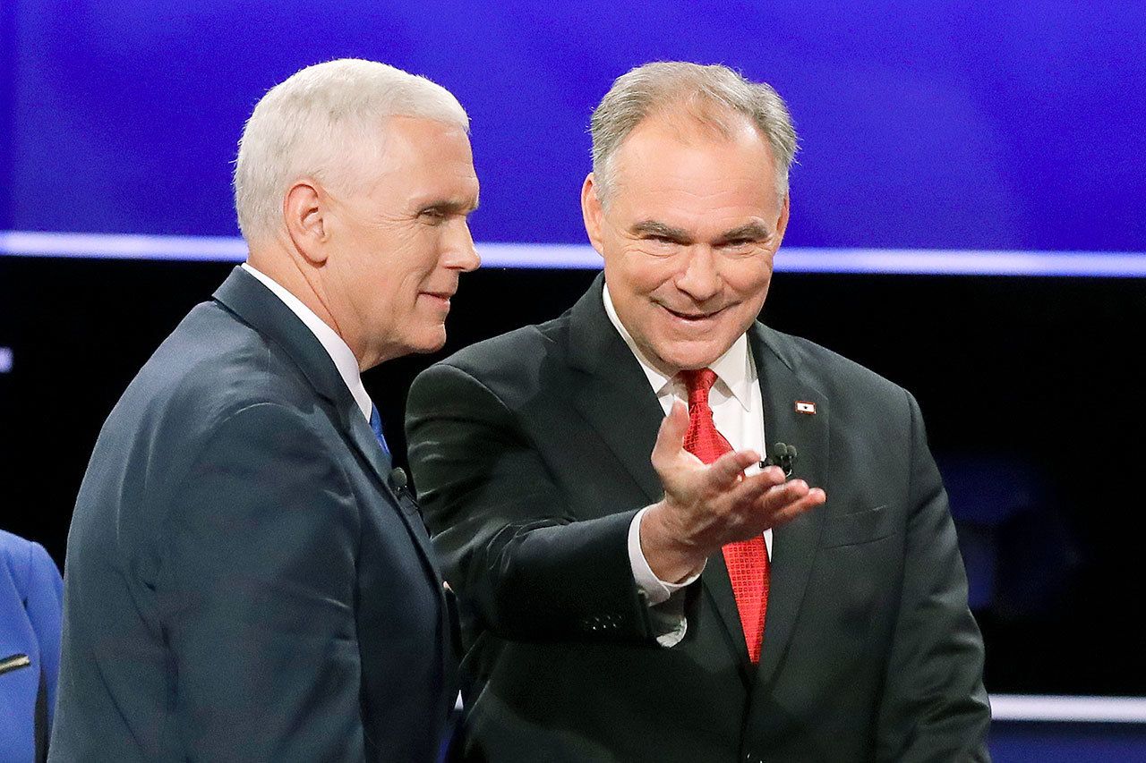 Republican nominee Gov. Mike Pence of Indiana and Democratic nominee Sen. Tim Kaine of Virginia walk off the stage after the vice-presidential debate at Longwood University in Farmville, Virginia, on Tuesday. (AP Photo/David Goldman)