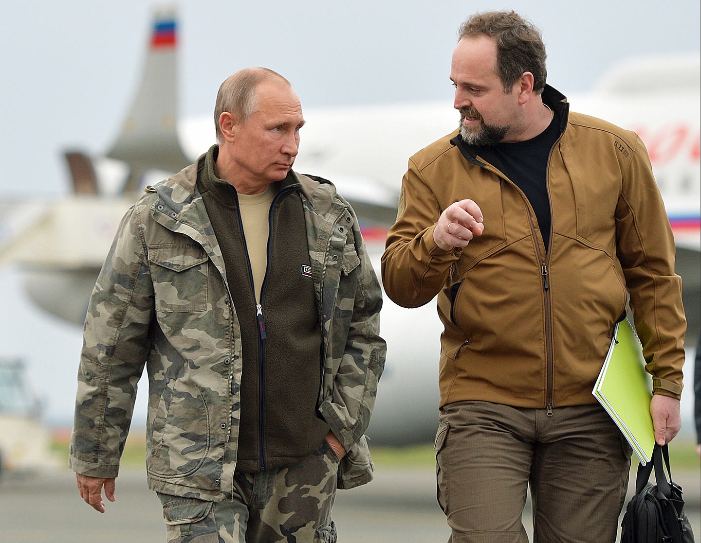Russian President Vladimir Putin, left, walks with Minister of Natural Resources and Environment Sergei Donskoi on arrival in the Urals city of Orenburg, about 800 miles southeast of Moscow, on Monday. (Alexei Druzhinin/Sputnik, Kremlin Pool Photo via AP)