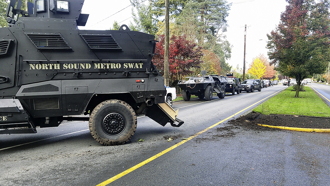 Multiple arrests were made Friday when Monroe police raided a suspected drug house along S. Lewis Street. (Monroe Police)