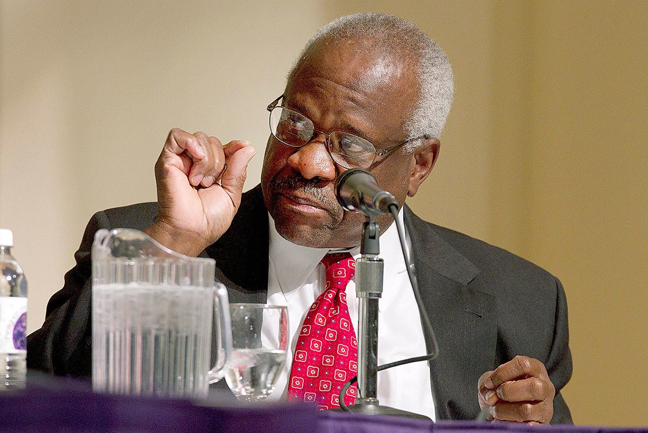 In this 2012 photo, Supreme Court Justice Clarence Thomas speaks at College of the Holy Cross in Worcester, Massachusetts. (AP Photo/Michael Dwyer, File)
