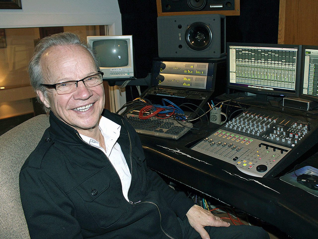 In this Dec. 18, 2013, photo, Bobby Vee poses at the studio console at his family’s Rockhouse Productions in St. Joseph, Minnesota. Vee, whose rise toward stardom began as a 15-year-old fill-in for Buddy Holly after Holly was killed in a plane crash, died Monday, Oct. 24, of complications from Alzheimer’s disease. He was 73. (AP Photo/Jeff Baenen, File)