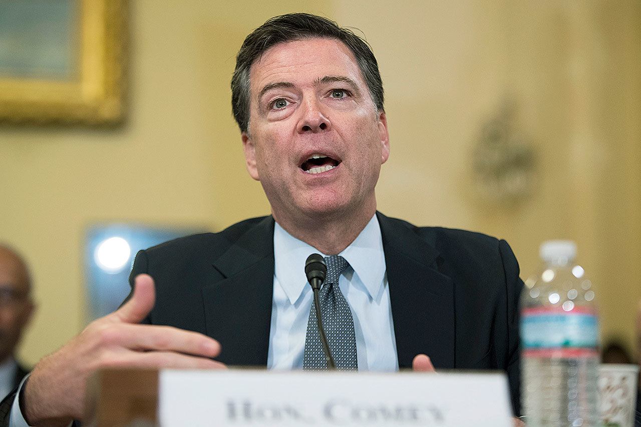 In this July 14, 2016, photo, FBI Director James Comey testifies on Capitol Hill in Washington. The FBI informed Congress Friday, Oct. 28, it is investigating whether there is classified information in new emails that have emerged in its probe of Hillary Clinton’s private server. The FBI said in July its investigation was finished. (AP Photo/Evan Vucci, File)