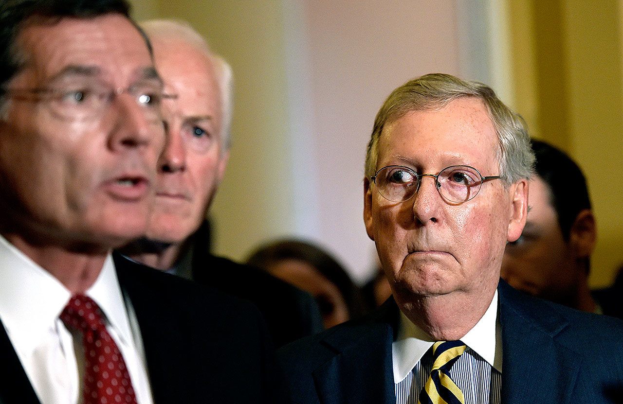 In this Sept. 7 photo, Senate Majority Leader Mitch McConnell of Kentucky listens at right as Sen. John Barrasso, R-Wyo., left, speaks during a news conference on Capitol Hill in Washington. Senate Majority Whip John Cornyn of Texas is at center. Senate confirmation of President Barack Obama’s nominees slowed to a halt this election year. (AP Photo/Susan Walsh, File)