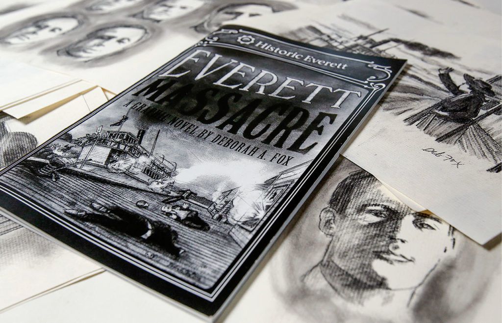 In her home studio, commercial artist Deb Fox created a graphic novel based on the Everett Massacre. The artist made charcoal drawings of scenes and characters, using historic photographs for reference. (Dan Bates / The Herald)
