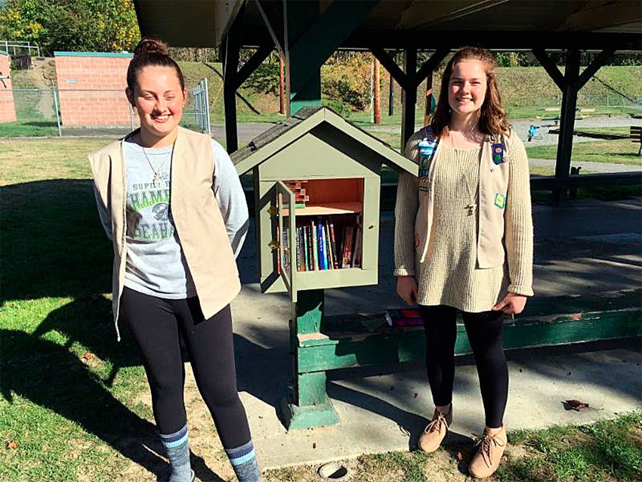 Arlington Girl Scouts Matilda Haskins and Abbey Fairbanks recently installed a Little Free Library at Haller Park for their Silver Award project. (Contributed photo)